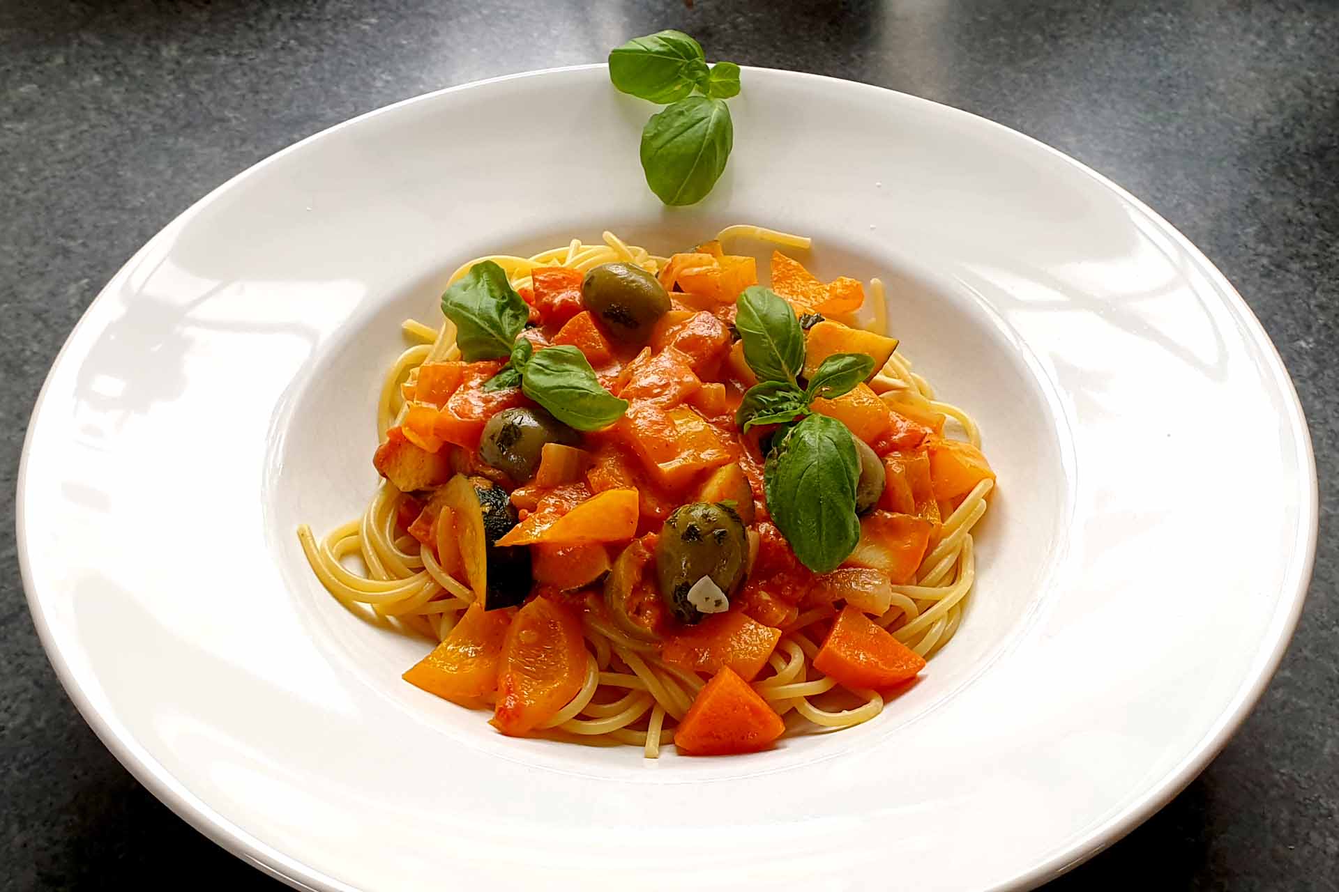 Spaghetti with vegetables in creamy tomato sauce - delicious