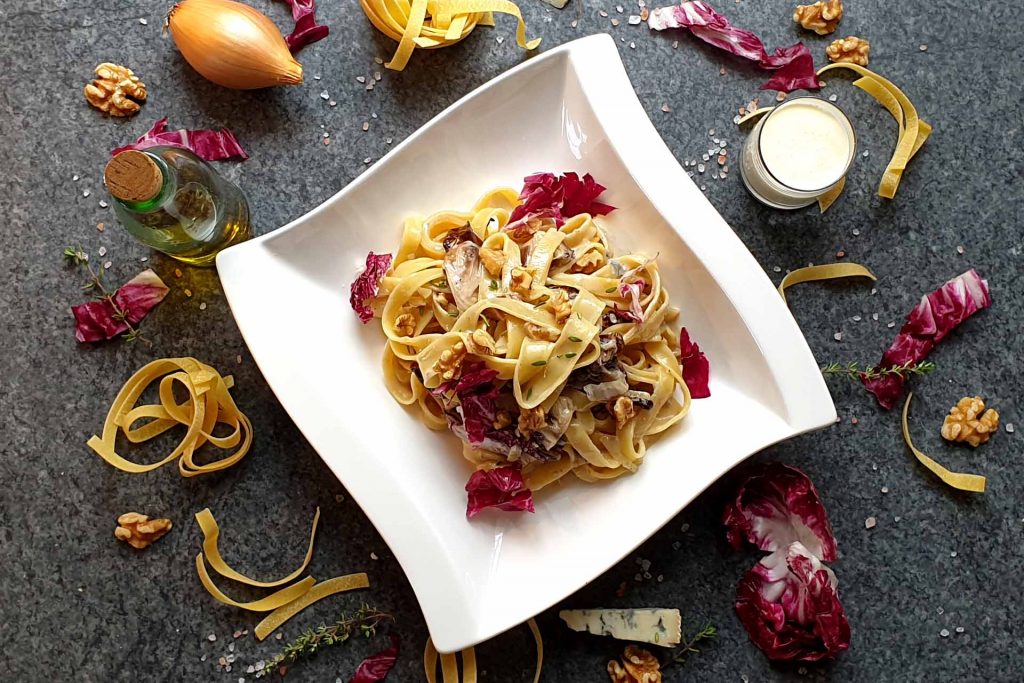 Pasta with gorgonzola sauce, walnuts and radicchio