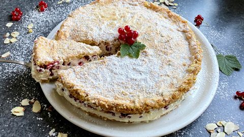Red currant tart with meringue and almonds