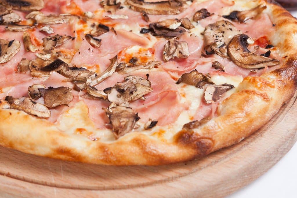 Pizza with ham and mushrooms